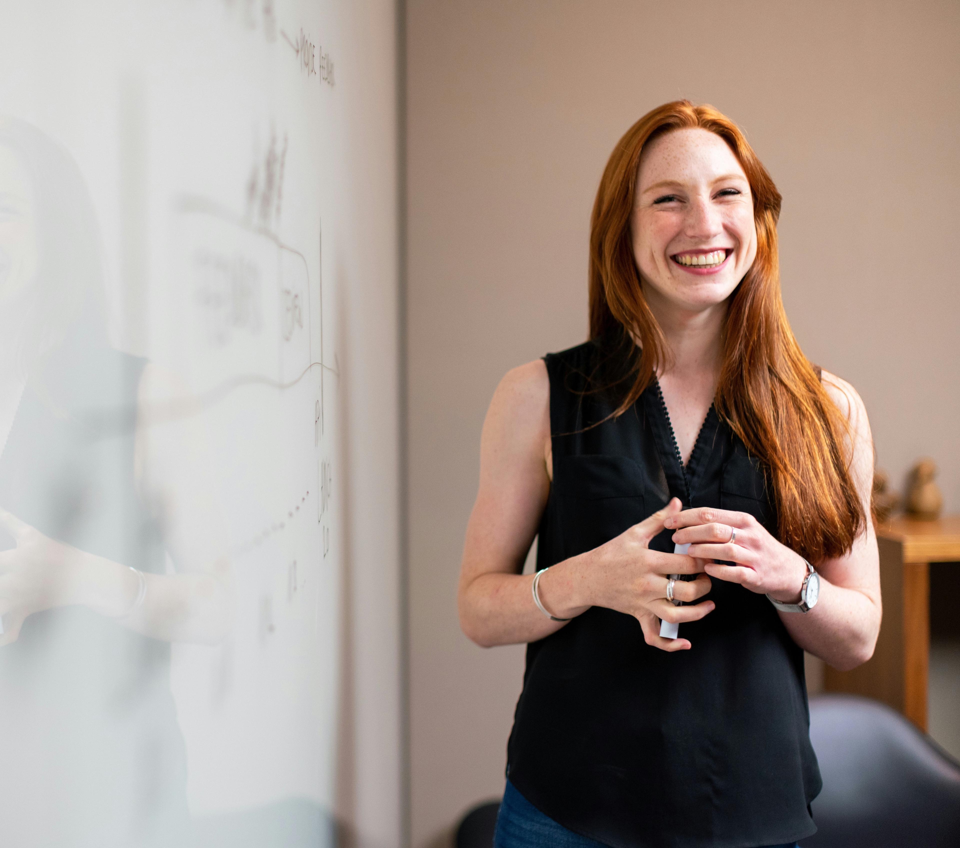Teacher with pen and whiteboard background